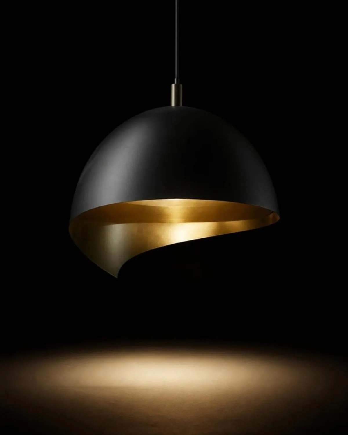 Black and brass dome pendant light on a dark background